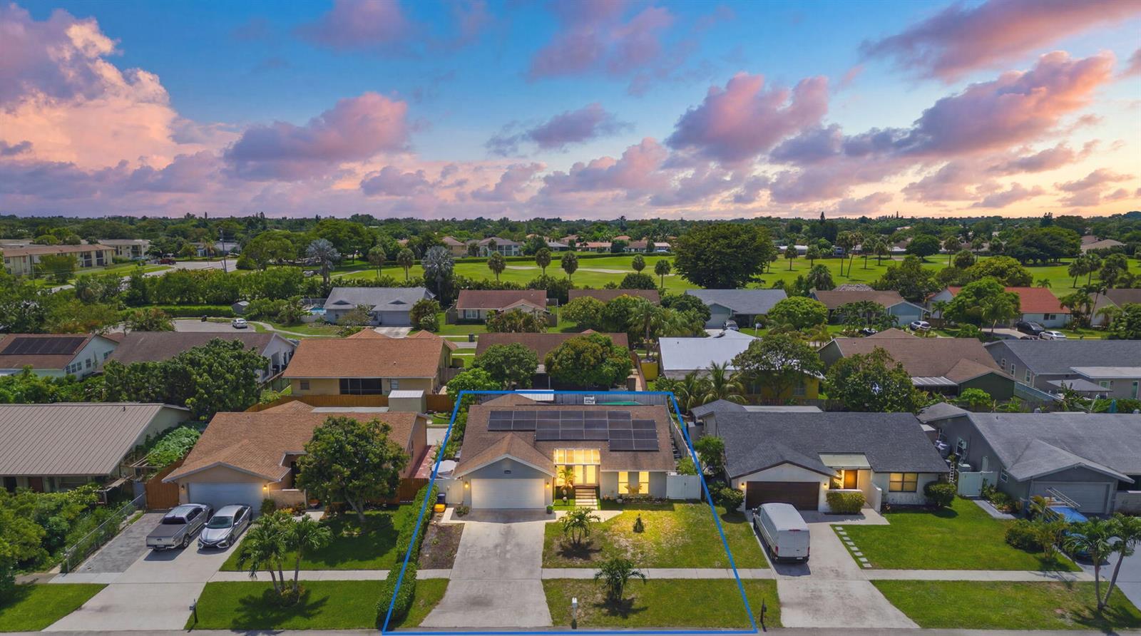 An aerial view of a single-story suburban house with solar panels on the roof — 23287 SW 60th Avenue, Boca Raton FL 33428, BOCA RATON, FL