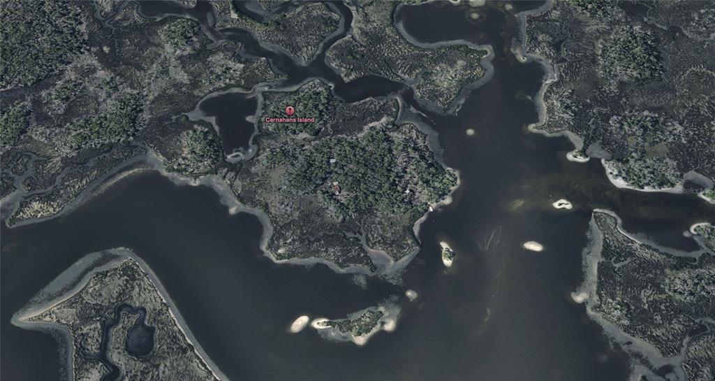 This aerial map view shows Carnahans Island surrounded by marshland and waterways — 6 CARNAHANS ISLAND, CRYSTAL RIVER, FL