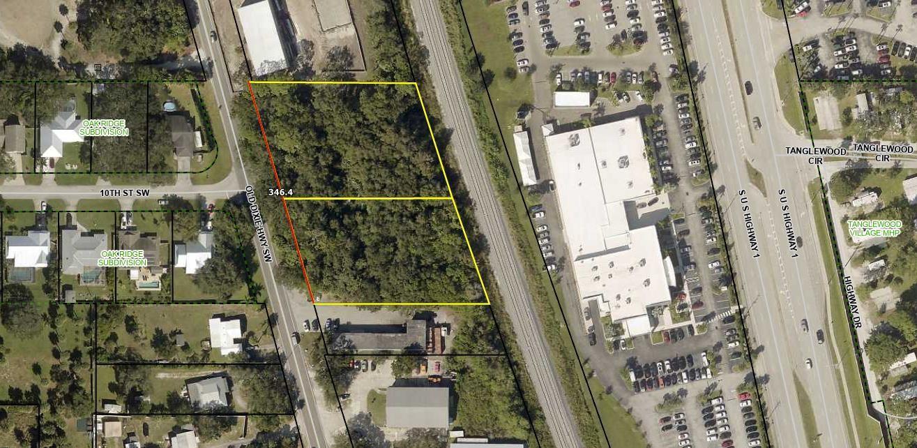 This is an aerial map showing a vacant, wooded lot outlined in yellow near a highway — 1010 Old Dixie Highway, Vero Beach FL 32962, VERO BEACH, FL