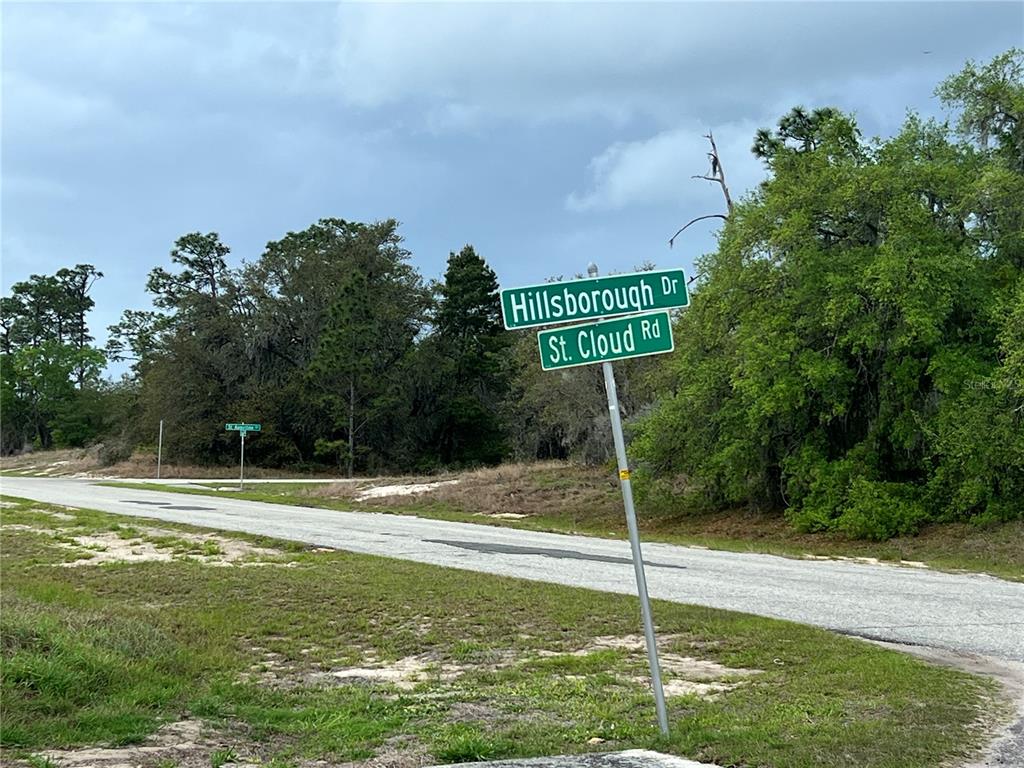 A street sign at the intersection of Hillsborough Drive and St. Cloud Road — 1337 HILLSBOROUGH DRIVE, POINCIANA, FL