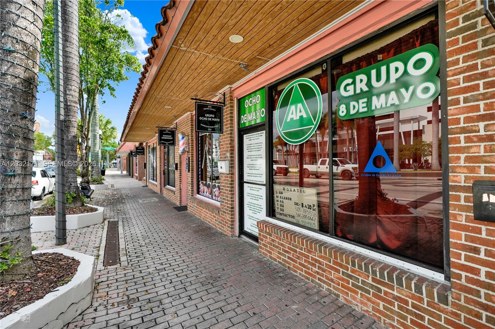 A brick storefront with an Alcoholics Anonymous sign and a sidewalk in a commercial district — 1 S Krome Ave, Homestead FL 33030, HOMESTEAD, FL