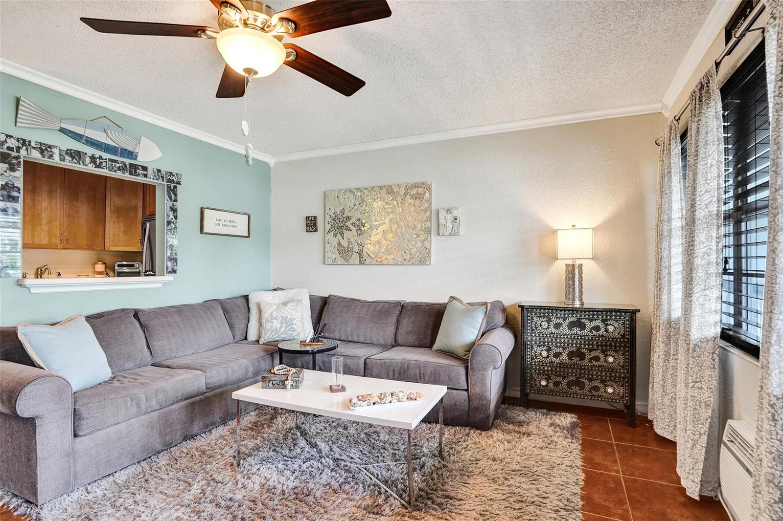 A living room features a gray sectional sofa, a white coffee table, and a ceiling fan — 227 Tilford K # 227, Deerfield Beach FL 33442, DEERFIELD BEACH, FL