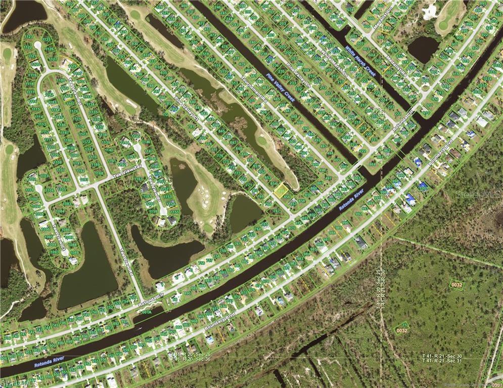 This is an aerial map of a residential neighborhood with canals and a golf course — 5 PINE VALLEY COURT, ROTONDA WEST, FL