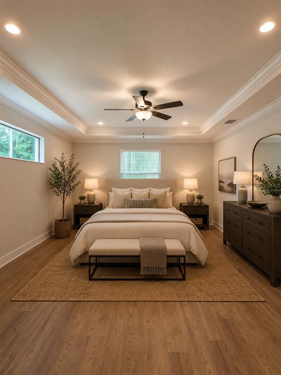A bedroom features a tray ceiling, a central ceiling fan, and a neutral color palette — 5619 SUMMIT VIEW DRIVE, BROOKSVILLE, FL