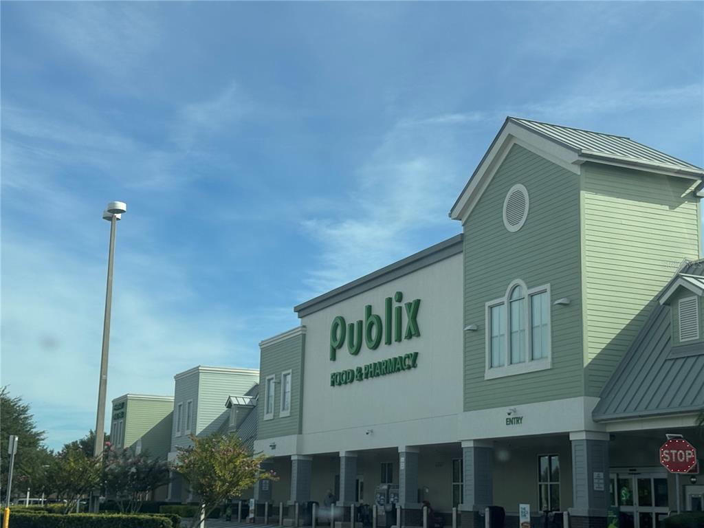 A Publix grocery store exterior with light green siding and a large parking lot — 6737 N US 98 HIGHWAY, LAKELAND, FL