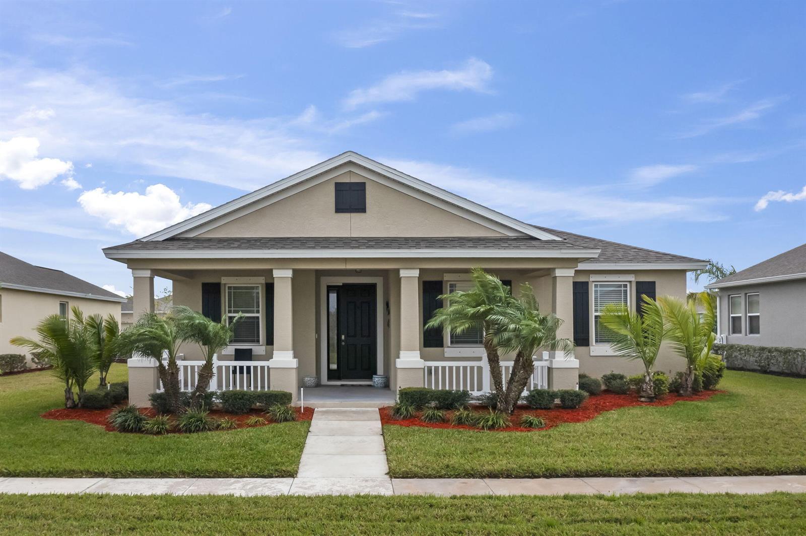 A single-story house with a front porch, palm trees, and a concrete walkway — 1465 Bruntsfield Terrace, Vero Beach FL 32966, VERO BEACH, FL