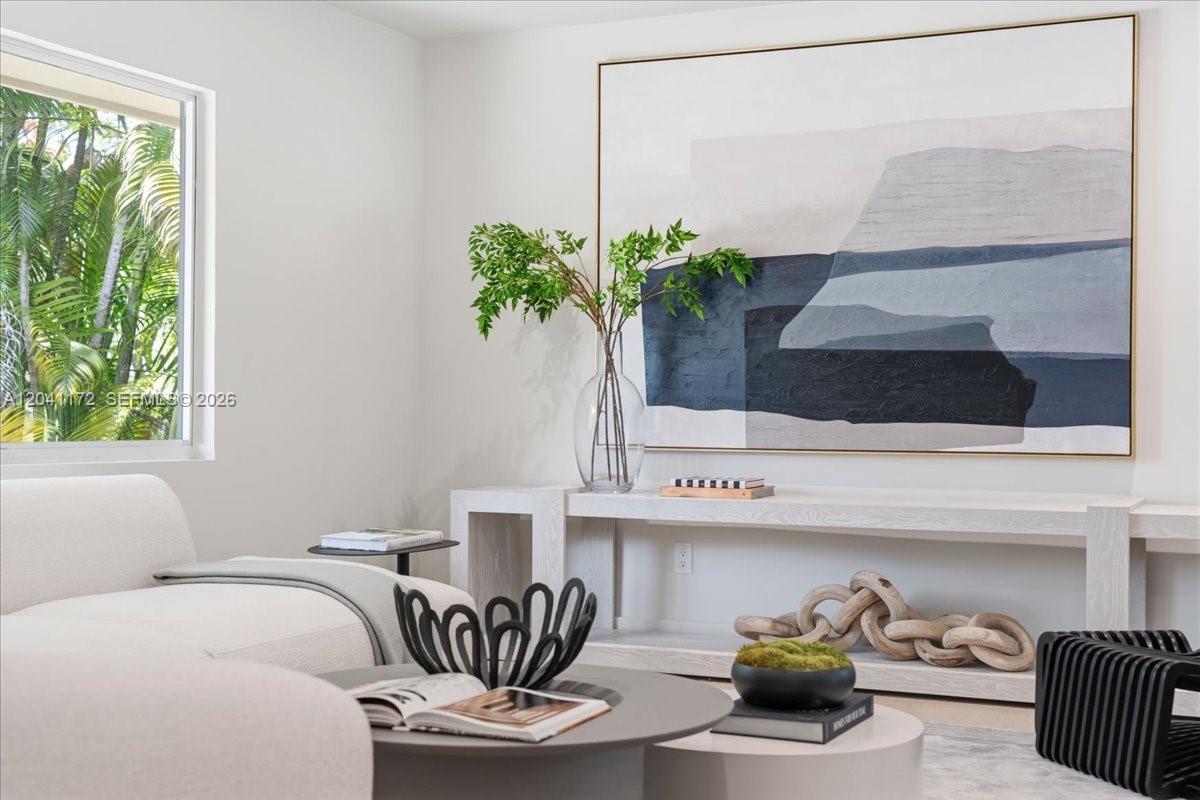 A modern living room features a large abstract painting, a console table, and a sofa — 6250 SW 48th St, Miami FL 33155, MIAMI, FL