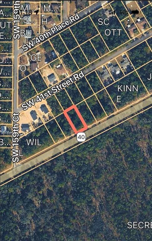 This is an aerial map showing a highlighted vacant lot along a paved road — 13769 SW 13TH PL, OCALA, FL