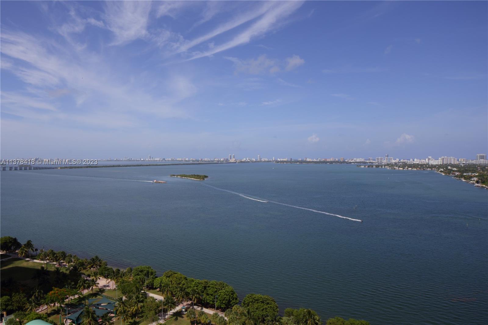 An elevated view shows a large bay with a small island and distant city skyline — 1750 N Bayshore Dr # 2602, Miami FL 33132, MIAMI, FL