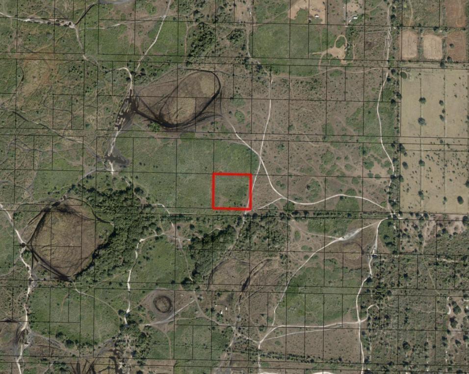 This is an aerial map showing a square parcel of land highlighted in red — 0 NW 312th Street, Okeechobee FL 34972, OKEECHOBEE, FL