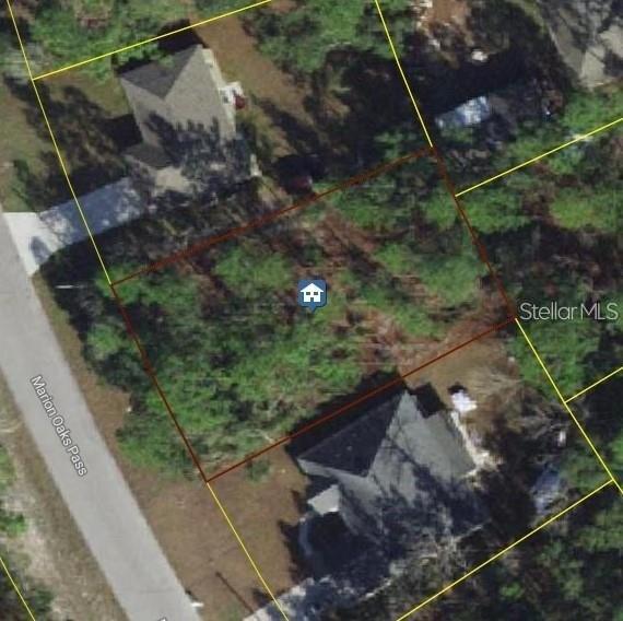 This is an aerial map view of a vacant residential lot between two houses — MARION OAKS PASS, OCALA, FL