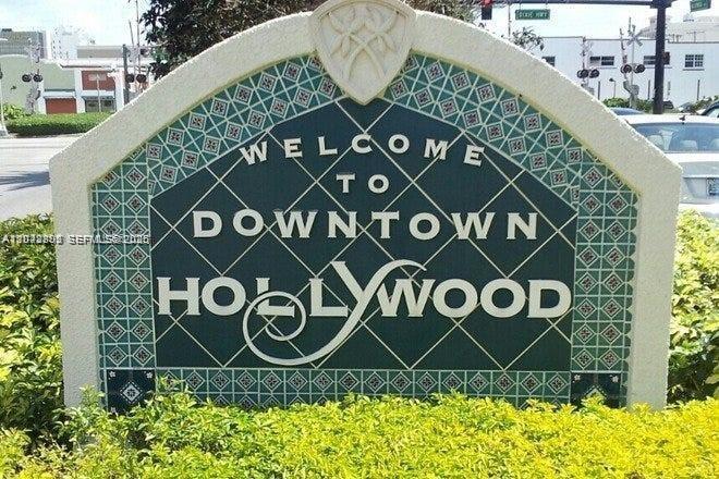 A decorative sign welcomes visitors to downtown Hollywood, Florida, surrounded by green landscaping — 2126 Arthur St # 1, Hollywood FL 33020, HOLLYWOOD, FL