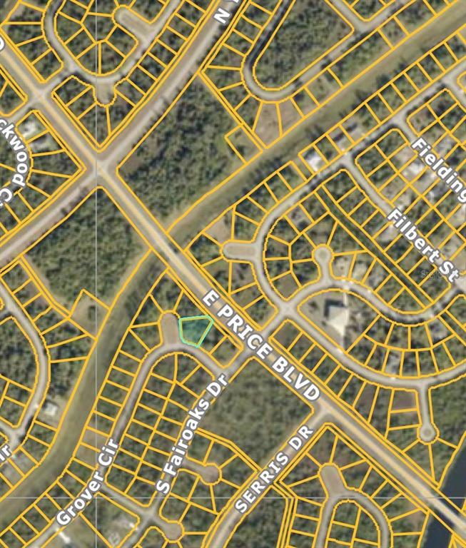 This is a satellite map view showing a highlighted vacant lot along a residential street — GROVER CIRCLE, NORTH PORT, FL