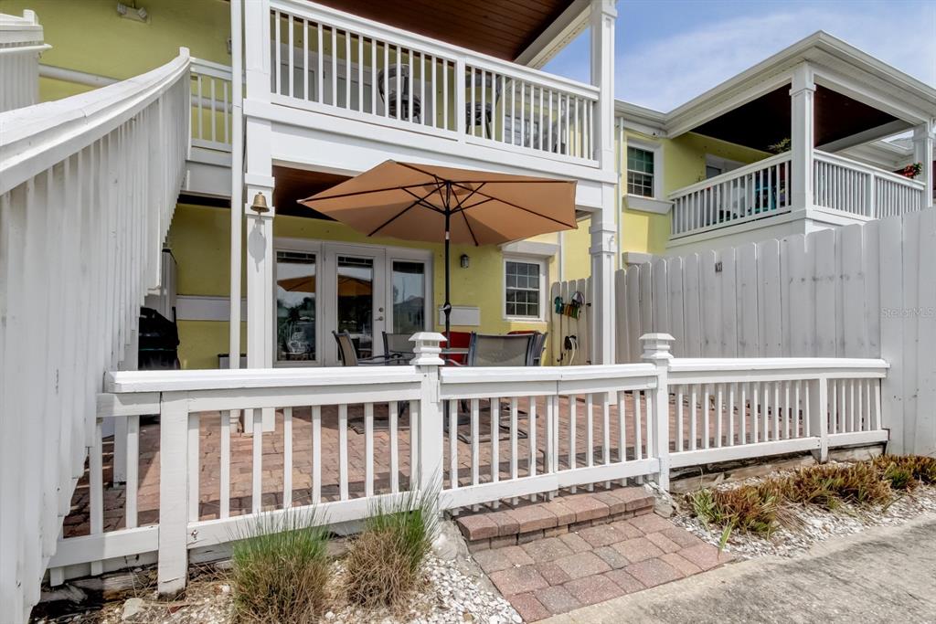 An aerial view shows a waterfront condominium complex with boat slips along a canal — 5092 BEACH DRIVE SE UNIT A, ST PETERSBURG, FL