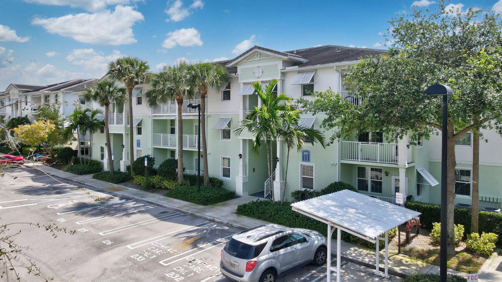 A three-story apartment building with light green siding and a parking lot in front — 3603 High Ridge Way # 302, Boynton Beach FL 33426, BOYNTON BEACH, FL