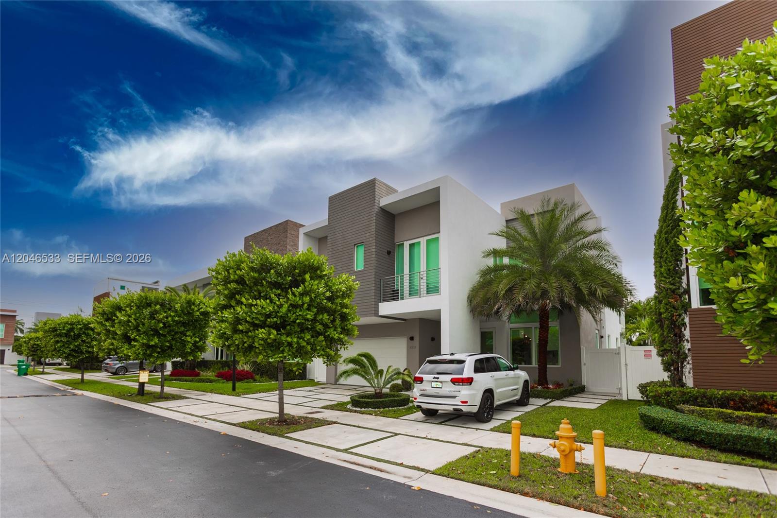 A modern two-story house with a white SUV parked in the driveway — 10561 NW 68th Ter, Doral FL 33178, DORAL, FL