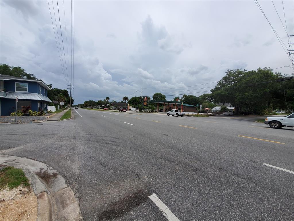 A view of a multi-lane road with a gas station and buildings in the distance — 903 N DIXIE FREEWAY, NEW SMYRNA BEACH, FL