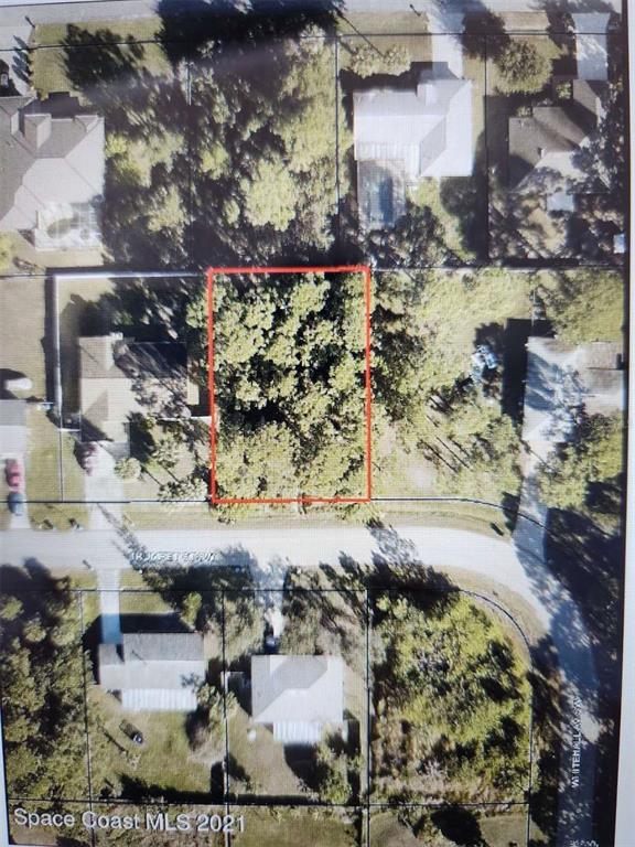 An aerial map shows a rectangular vacant lot outlined in red within a residential neighborhood — 447 TRUMPET STREET SW, PALM BAY, FL