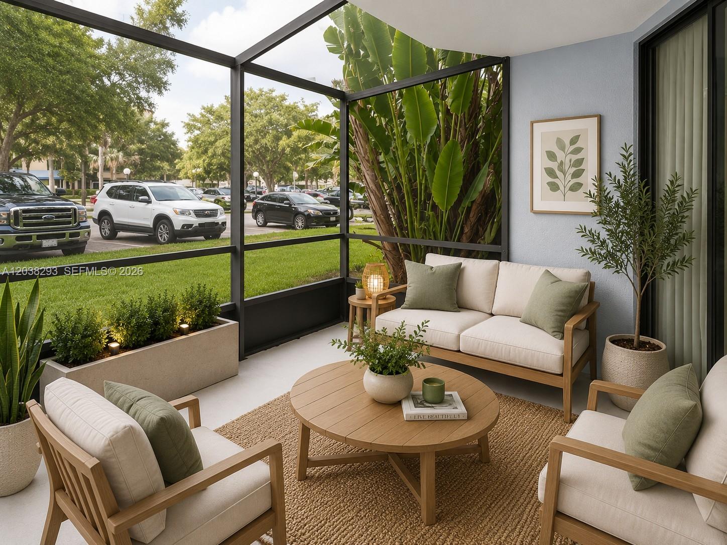 A screened-in patio features outdoor furniture, potted plants, and a view of a parking lot — 8255 SW 152nd Ave # 101, Miami FL 33193, MIAMI, FL