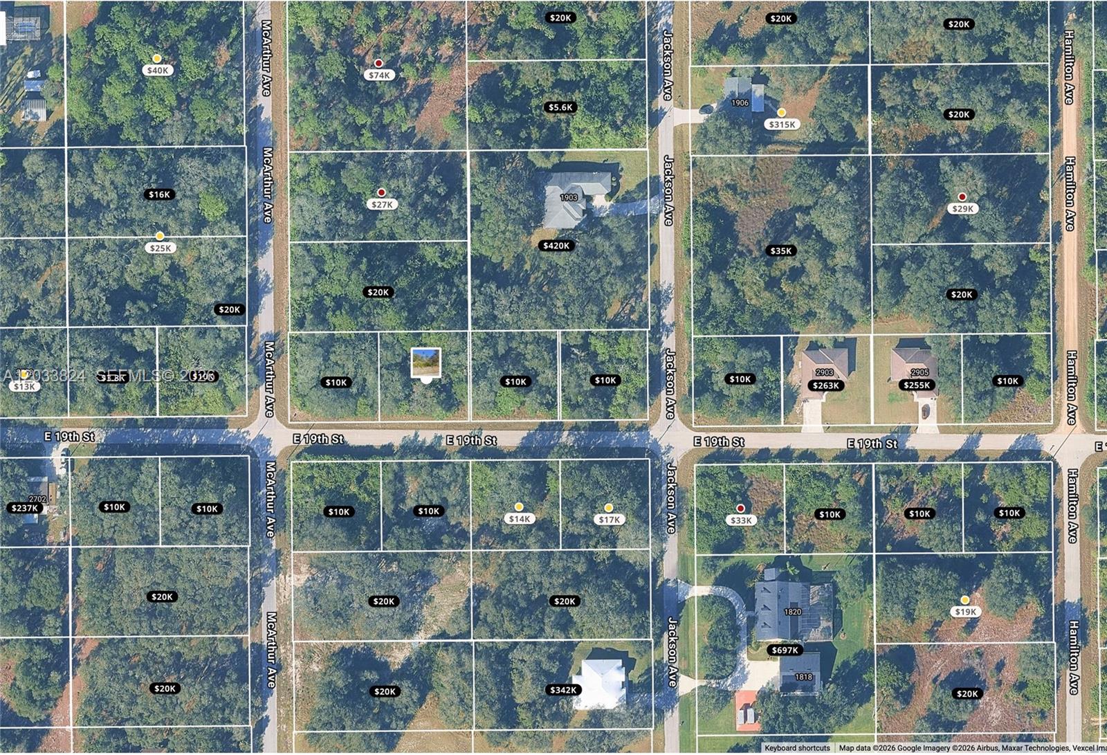 This is an aerial map showing residential lots and houses in a neighborhood — 2803 E 19th St, Lehigh Acres FL 33972, LEHIGH ACRES, FL