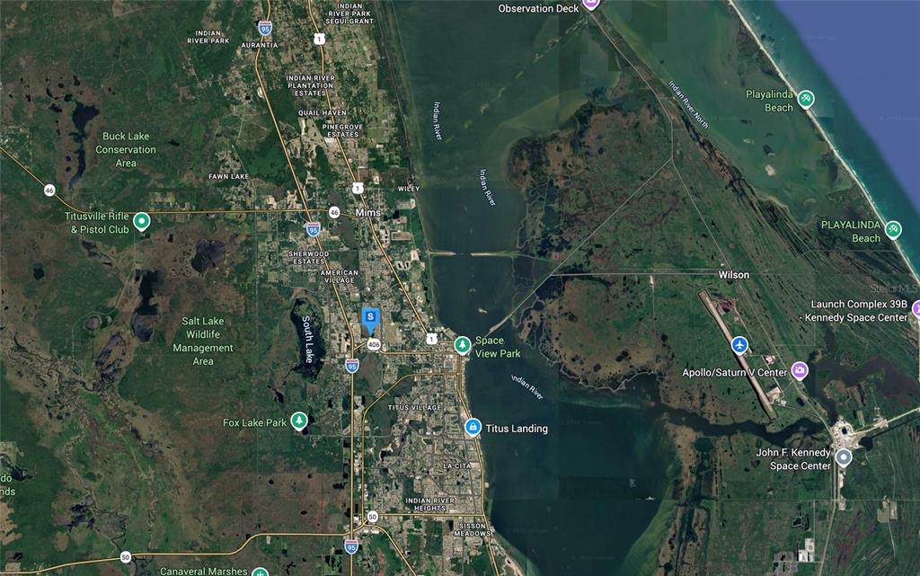 This is a satellite map showing the area surrounding Titusville and the Kennedy Space Center — 3080 ELDER STREET, TITUSVILLE, FL