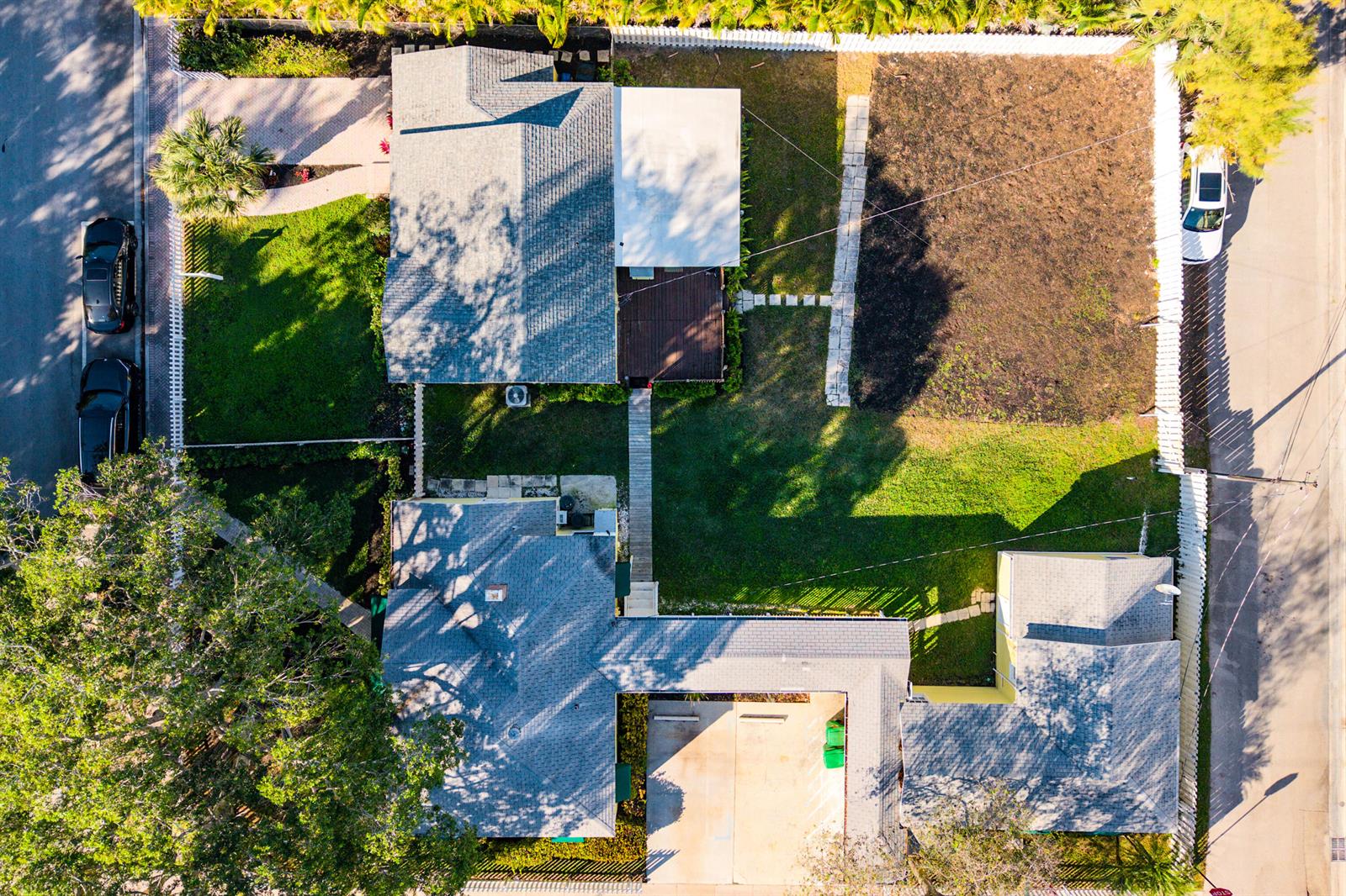 An aerial view shows two houses with shingled roofs, green lawns, and a shared driveway — 201 NE 1st Avenue, Delray Beach FL 33444, DELRAY BEACH, FL