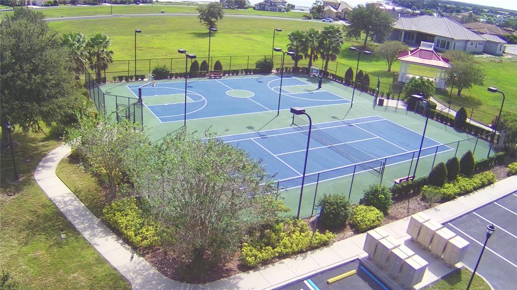 An aerial view shows a fenced outdoor basketball court and a tennis court — 361 ADAMS VIEW LANE, AUBURNDALE, FL