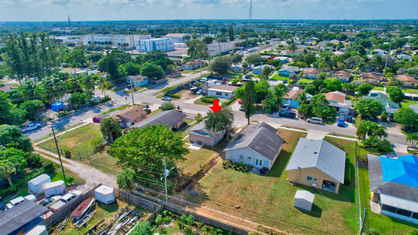 An aerial view shows a residential neighborhood with a red arrow pointing to a house — 237 SW 11th Avenue, Delray Beach FL 33444, DELRAY BEACH, FL