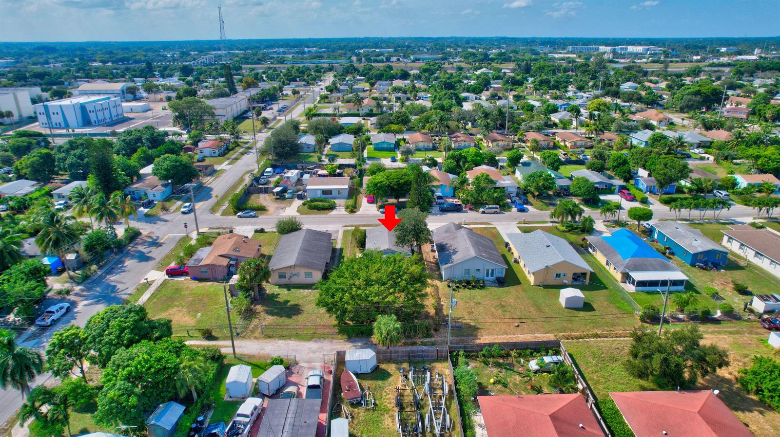 An aerial view of a residential neighborhood with a red arrow pointing to a house — 237 SW 11th Avenue, Delray Beach FL 33444, DELRAY BEACH, FL