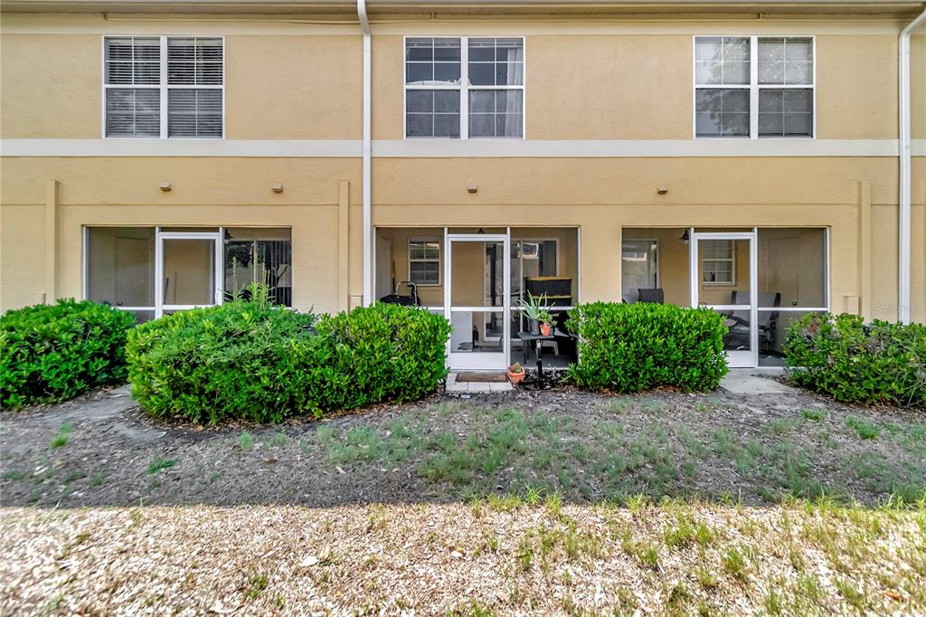 A living room features a brown sectional sofa, a recliner, and a gallery wall — 213 DRAW BRIDGE LANE, VALRICO, FL