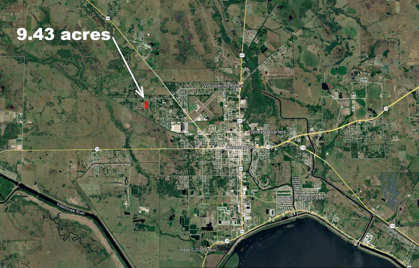 An aerial map shows a highlighted 9.43-acre property located west of Okeechobee, Florida — 5573 NW 24th Street, Okeechobee FL 34972, OKEECHOBEE, FL