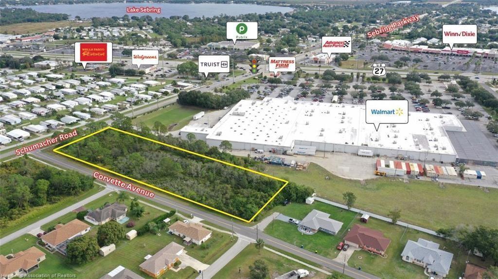 This aerial map shows a vacant, rectangular lot outlined in yellow near a shopping center — 3237 Schumacher Road, Sebring FL 33872, SEBRING, FL