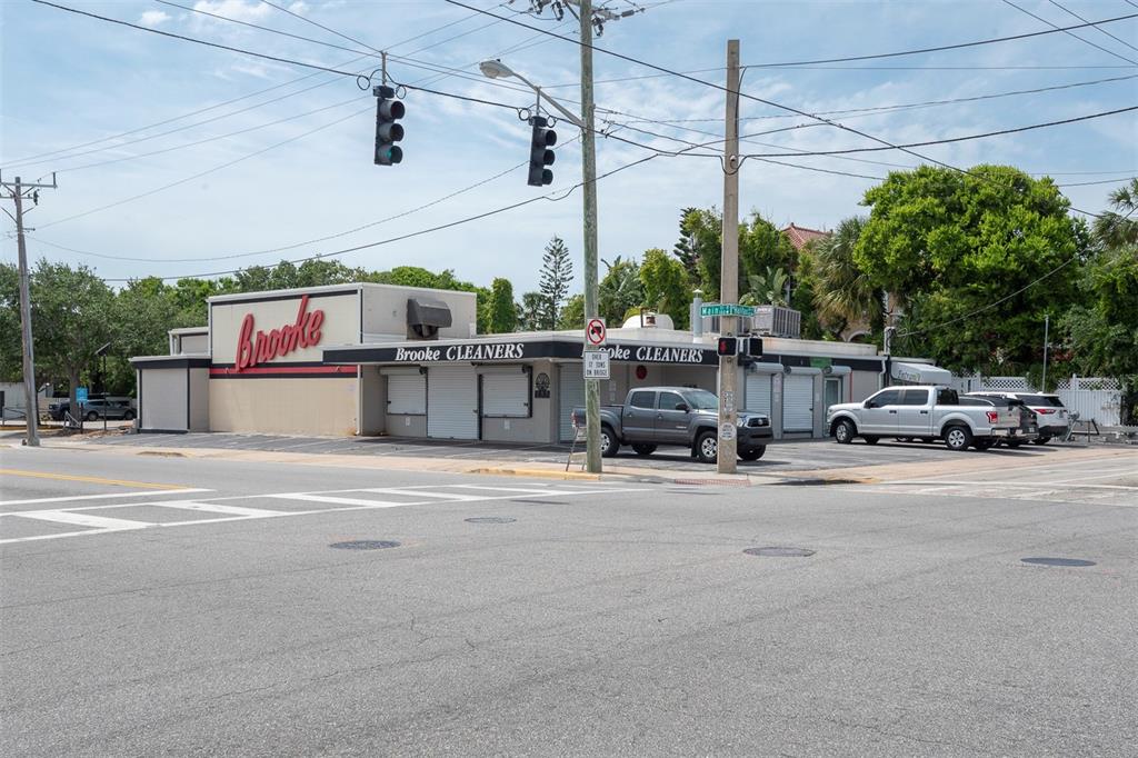 A commercial building with Brooke Cleaners signage sits on a corner lot at an intersection — 133 MAIN STREET E, DAYTONA BEACH, FL