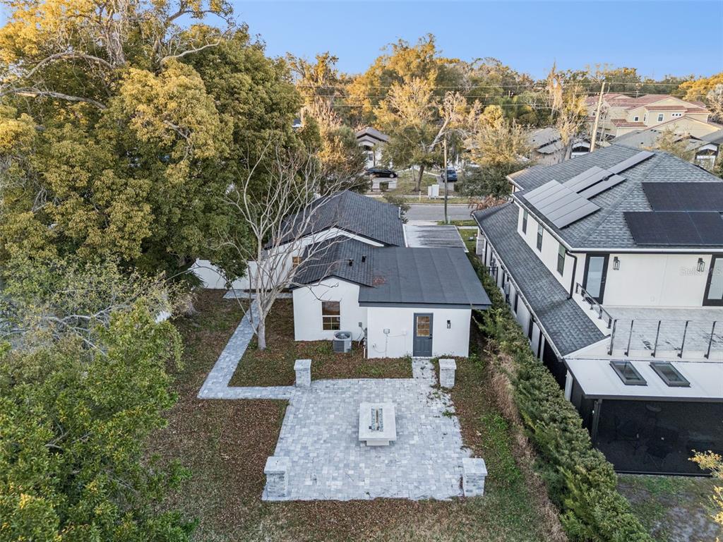 An aerial view shows a small white house with a dark roof and a stone patio — 1354 INDIANA AVENUE, WINTER PARK, FL
