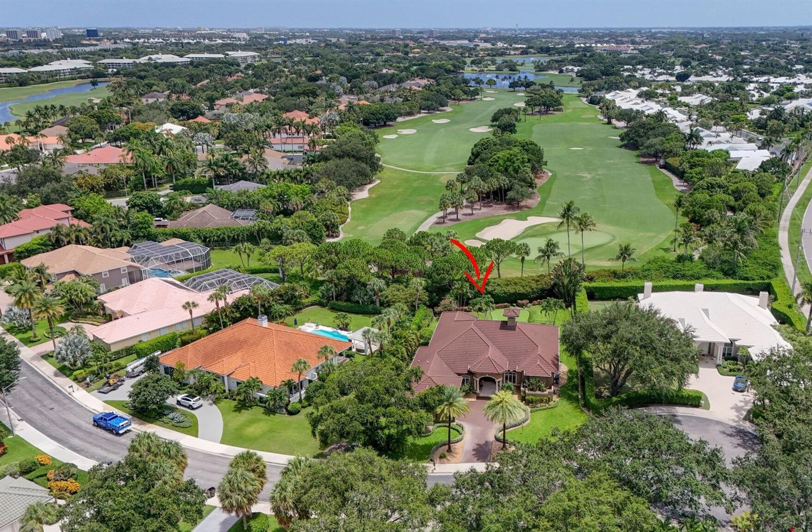 An aerial view of a suburban house with a brown roof bordering a golf course — 2773 Tecumseh Drive, West Palm Beach FL 33409, WEST PALM BEACH, FL