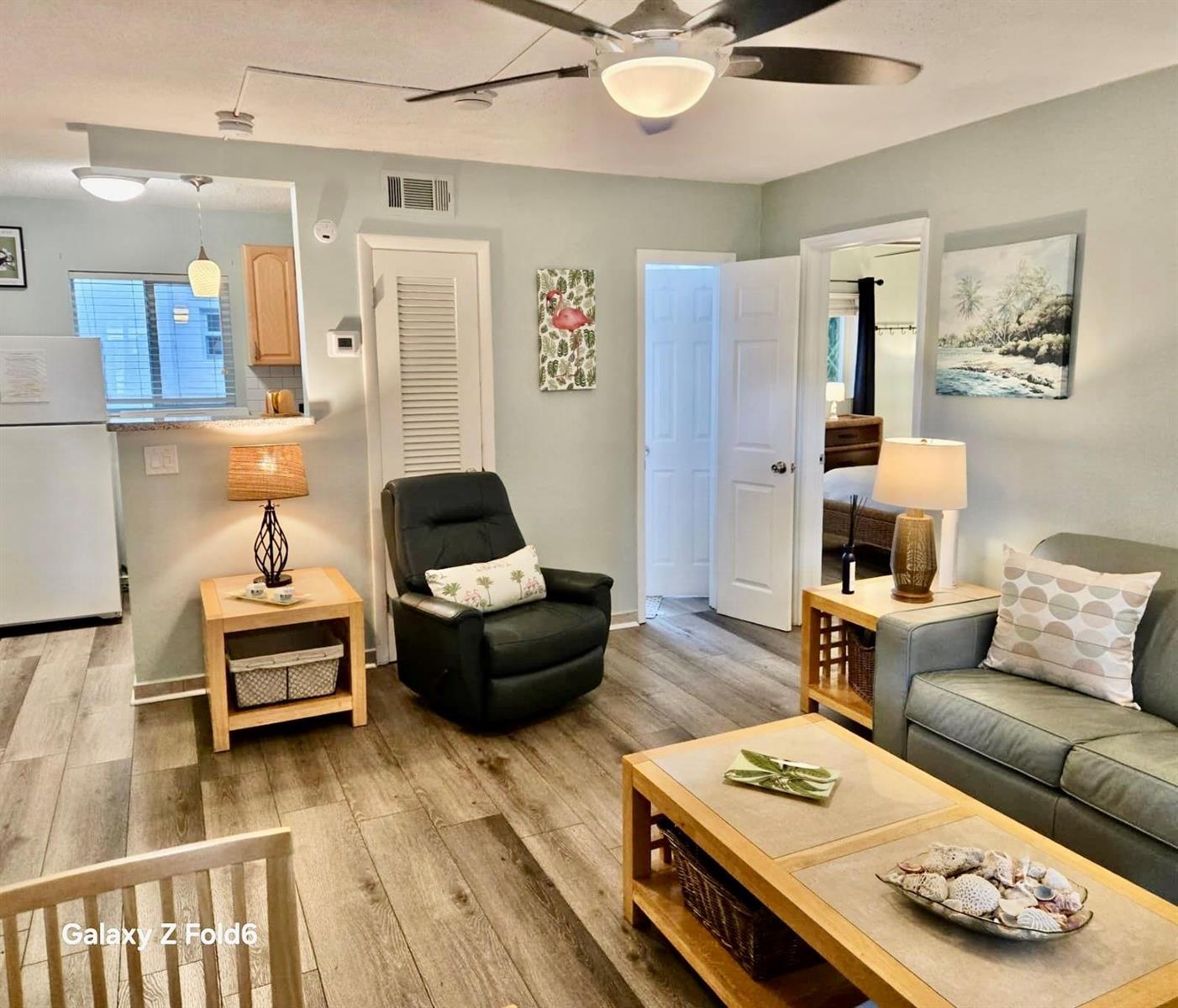A living room features light-colored walls, wood-look flooring, a ceiling fan, and a sofa — 3225 NE 16th Street # 9A, Pompano Beach FL 33062, POMPANO BEACH, FL