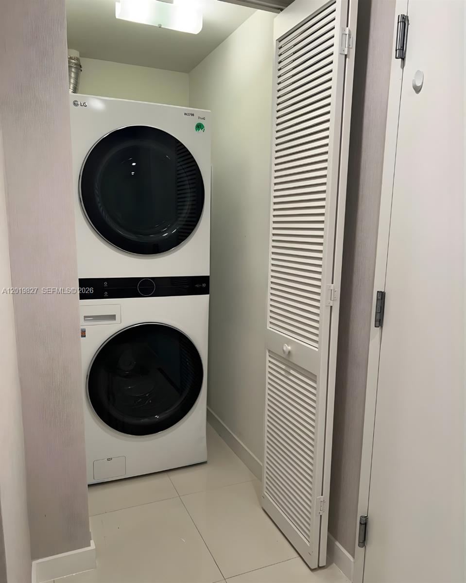 A stacked LG washer and dryer unit is located in a small laundry closet — 7875 NW 107th Ave # 412, Doral FL 33178, DORAL, FL