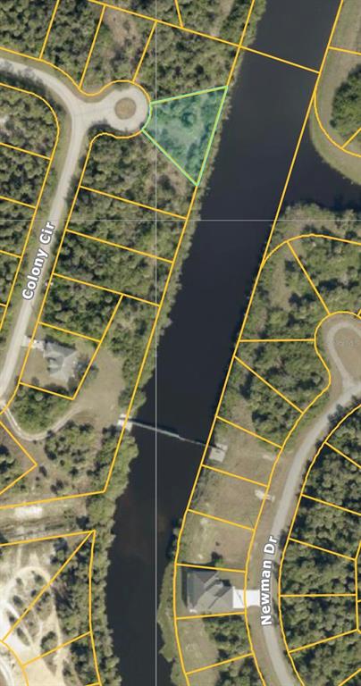 This map shows a triangular waterfront lot highlighted in green at the end of a cul-de-sac — BEN COURT, NORTH PORT, FL