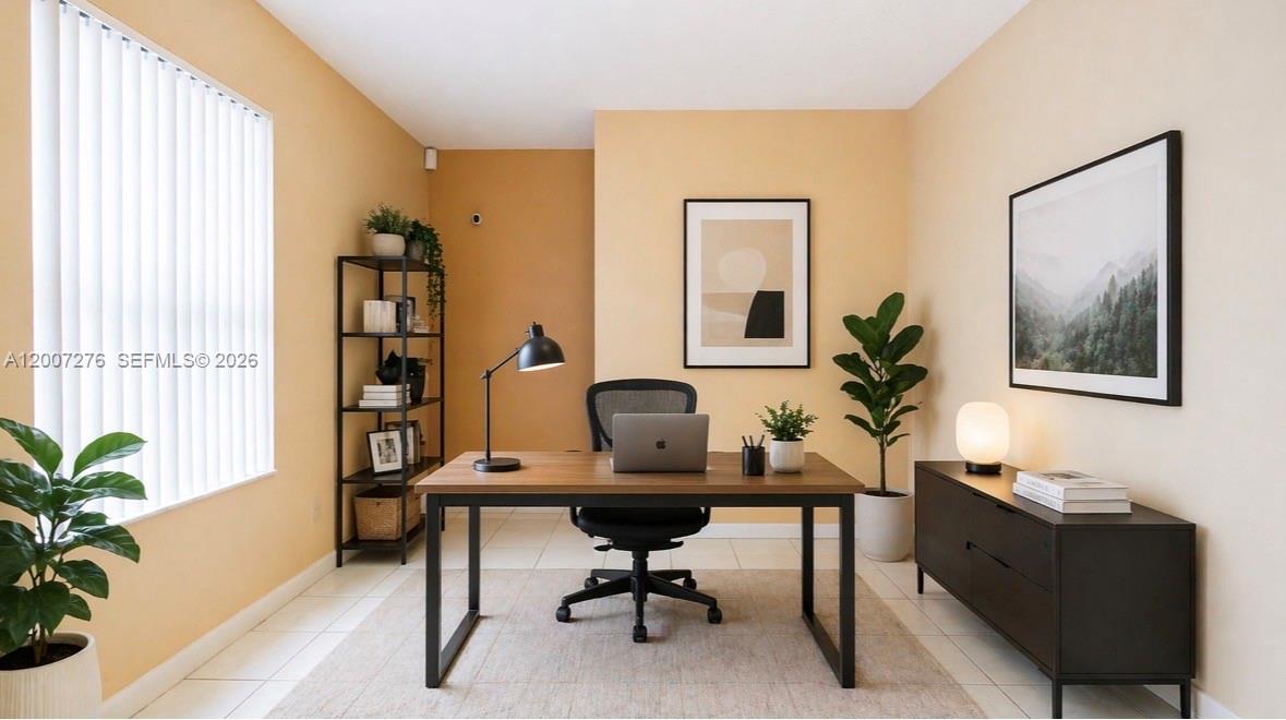 A home office features a desk, chair, shelving unit, and wall art on tiled floors — 17626 SW 20th St, Miramar FL 33029, MIRAMAR, FL