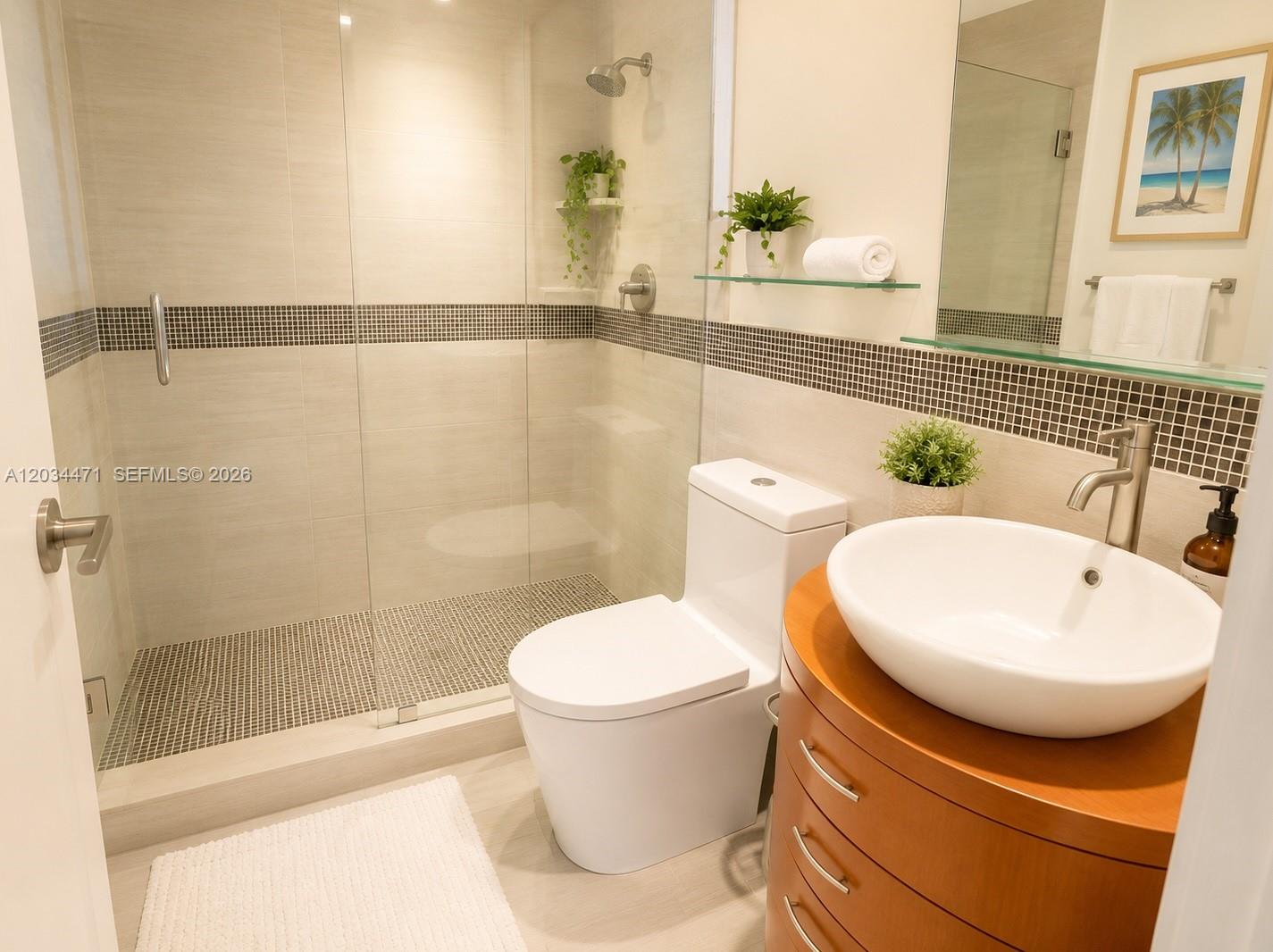 A modern bathroom features a glass-enclosed walk-in shower, a white toilet, and a vessel sink — MIAMI BEACH, FL