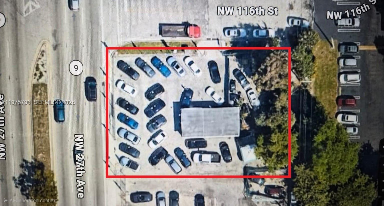 A fenced, paved lot features a small, light-colored building with green-trimmed windows — 11537 NW 27th Ave, Miami FL 33167, MIAMI, FL