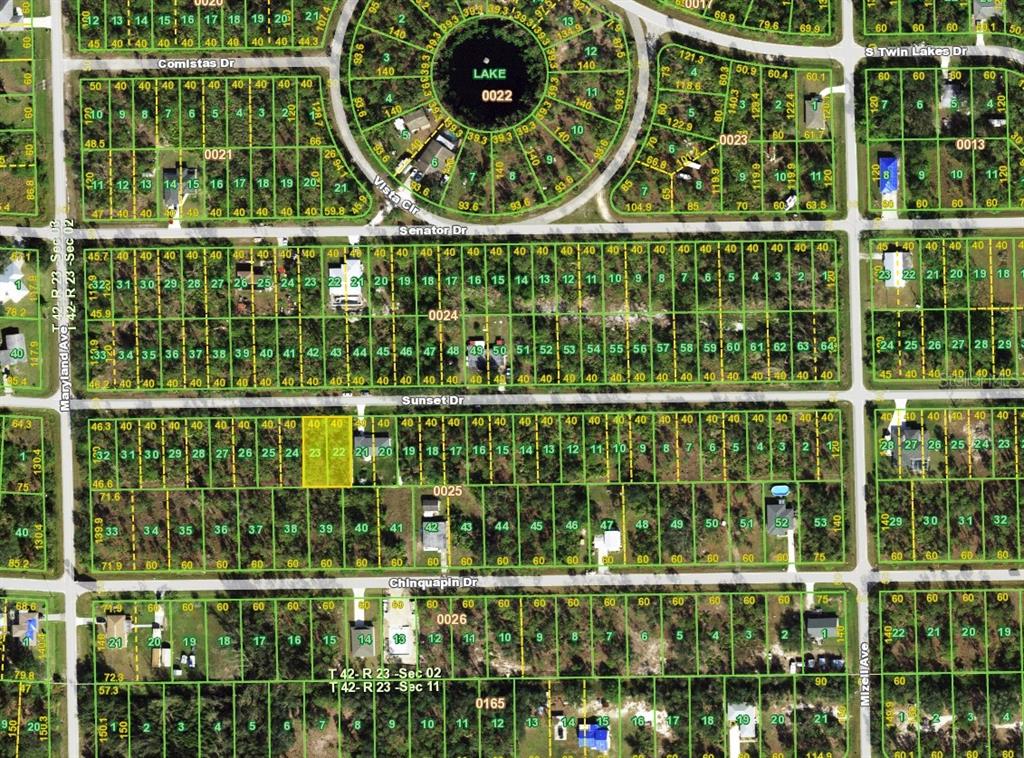 This is a property tax map showing residential lots, streets, and a central lake — 28041 & 28045 SUNSET DRIVE, PUNTA GORDA, FL