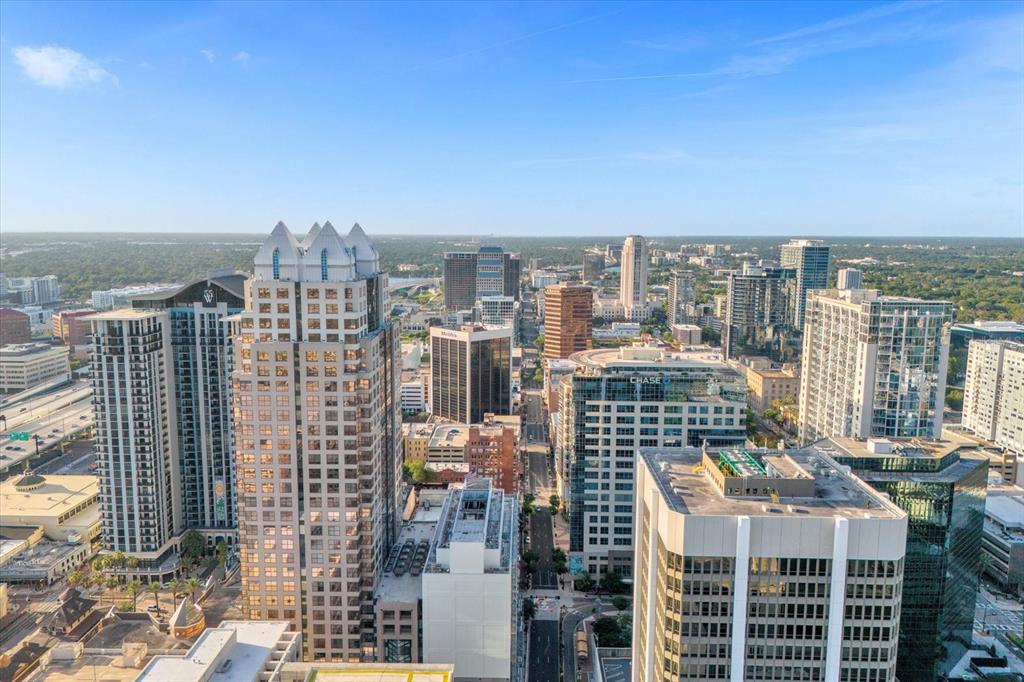 An aerial view of a dense city skyline featuring numerous high-rise office and residential buildings — 189 S ORANGE AVENUE UNIT 1550-1570, ORLANDO, FL