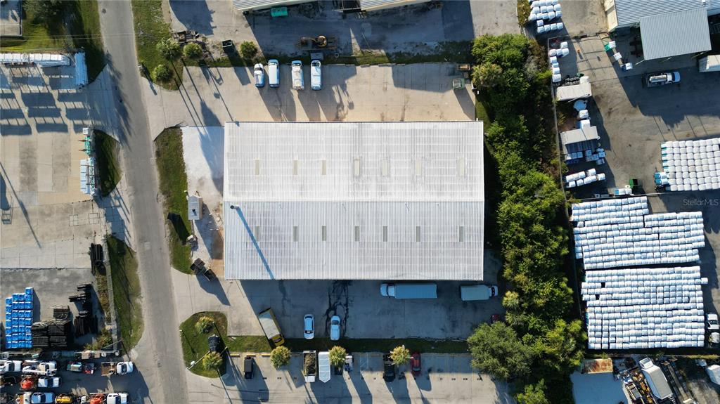 An aerial view shows a large industrial building surrounded by parking lots and storage areas — 4240 JAMES STREET UNIT 10,11,12,13,14, PUNTA GORDA, FL