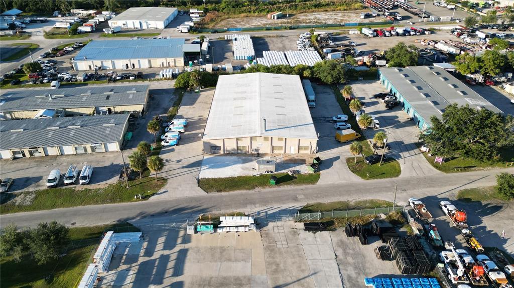 An aerial view shows several industrial warehouse buildings with surrounding parking lots and storage areas — 4240 JAMES STREET UNIT 10,11,12,13,14, PUNTA GORDA, FL
