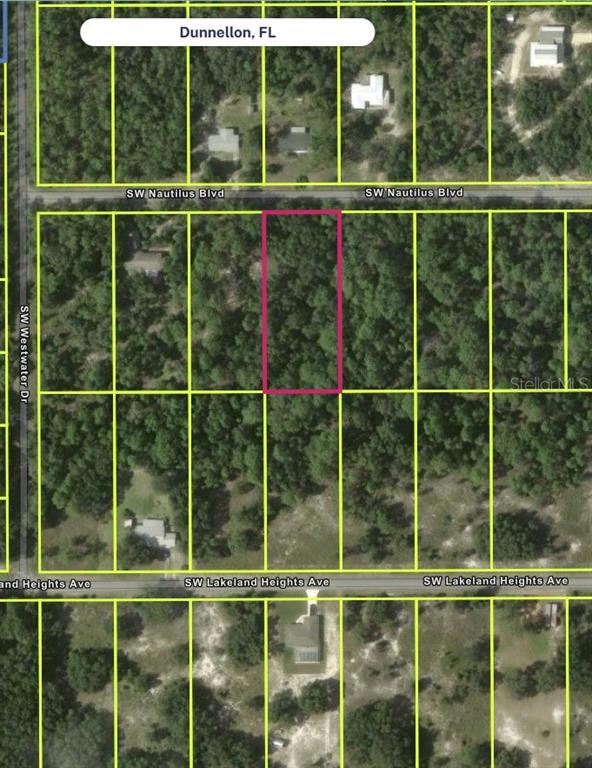 This is an aerial map showing a vacant, wooded residential lot outlined in pink — SW NAUTILUS BLVD, DUNNELLON, FL