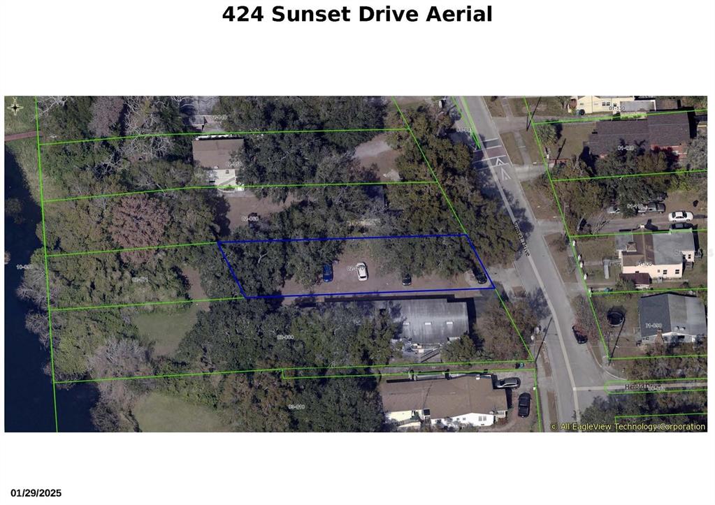 This aerial map shows a property lot outlined in blue with surrounding parcels and vegetation — 424 SUNSET DRIVE, ORLANDO, FL