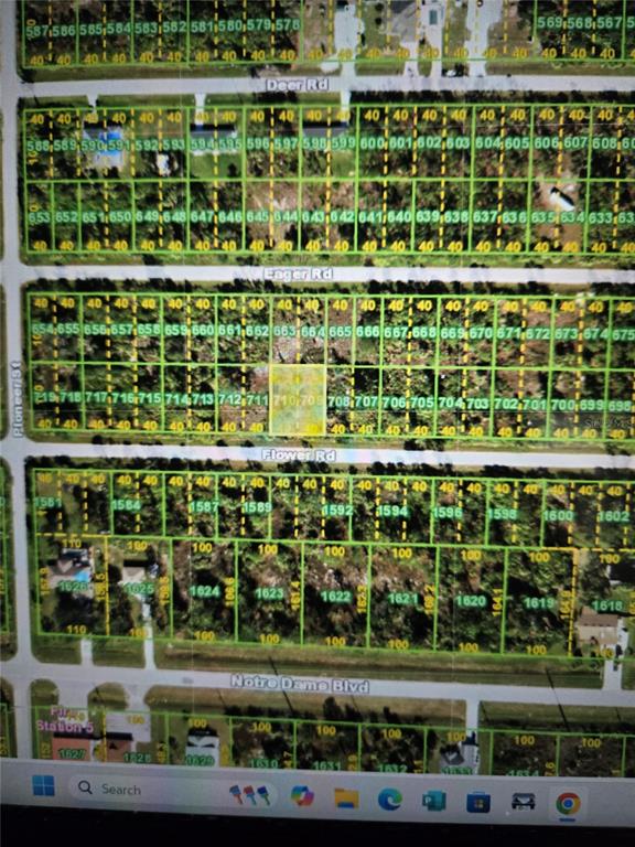 This is a map showing a grid of residential land parcels and street names — 26320 FLOWER ROAD, PUNTA GORDA, FL