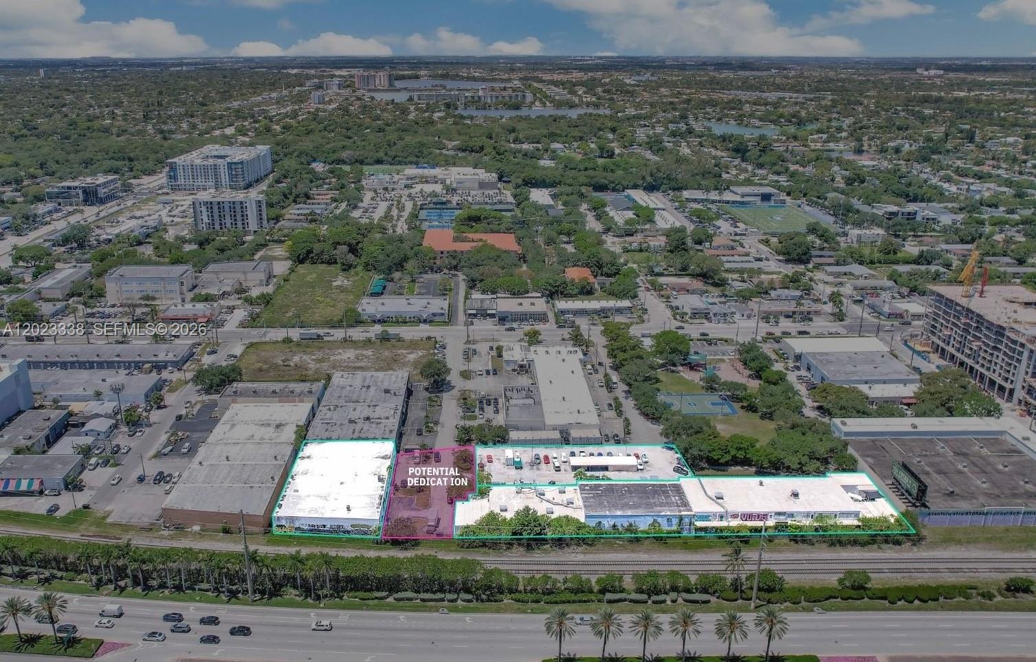 An aerial view shows a commercial property with outlined buildings and a potential dedication area — 2660 NE 189th St, Miami FL 33180, MIAMI, FL