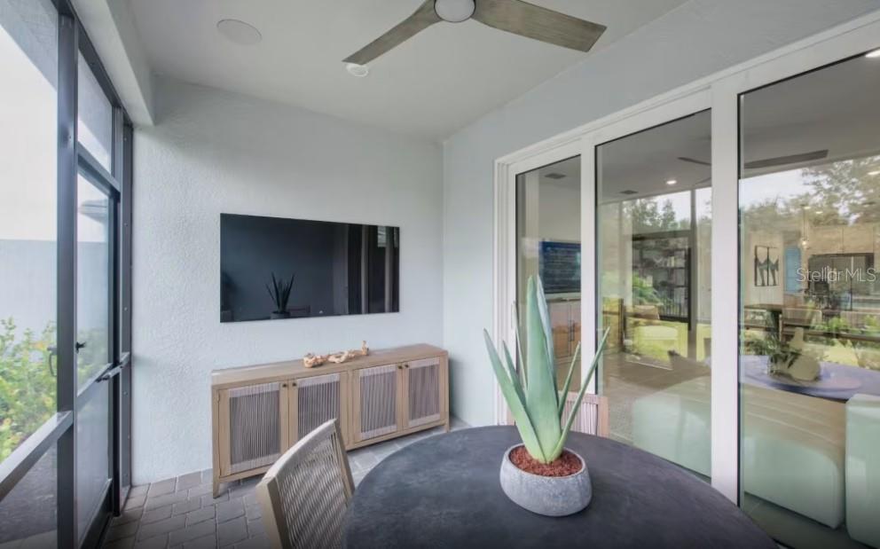 A light blue single-story house with a white garage door and a paved driveway — 1604 TAVIRA PLACE, ENGLEWOOD, FL